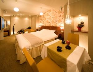 Ein Bett oder Betten in einem Zimmer der Unterkunft Carrot ISE (Adult Only)