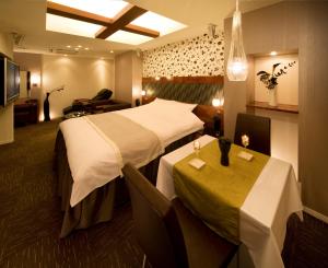 Ein Bett oder Betten in einem Zimmer der Unterkunft Carrot ISE (Adult Only)