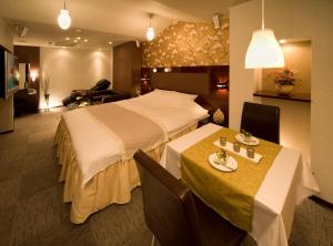 Ein Bett oder Betten in einem Zimmer der Unterkunft Carrot ISE (Adult Only)