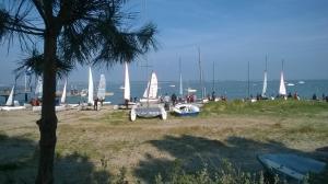 a group of sail boats on the water with people at Hôtel L'Albatros in Saint-Trojan-les-Bains