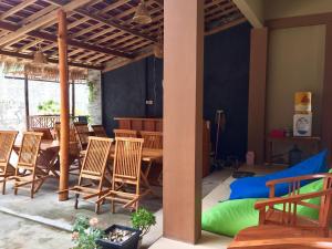 a dining room with a table and chairs at Asta Homestay in Karimunjawa