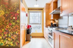 a kitchen with a floral wallpaper on the wall at The Park At Holyrood in Edinburgh