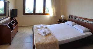 Posteľ alebo postele v izbe v ubytovaní Twin Villas