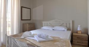 Posteľ alebo postele v izbe v ubytovaní Twin Villas