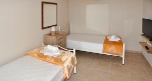 Posteľ alebo postele v izbe v ubytovaní Twin Villas