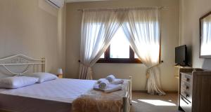 Posteľ alebo postele v izbe v ubytovaní Twin Villas