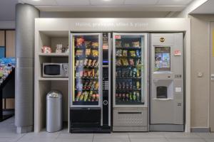 a drink vending machine in a store with drinks at B&B HOTEL Calais Centre St Pierre in Calais