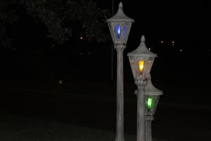 two street lights are lit up at night at The Guesthouse in Vanderbijlpark