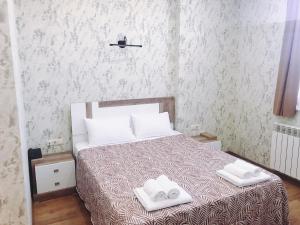 Postel nebo postele na pokoji v ubytování Dream Tower