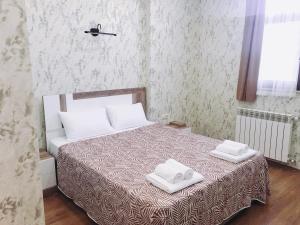 Postel nebo postele na pokoji v ubytování Dream Tower