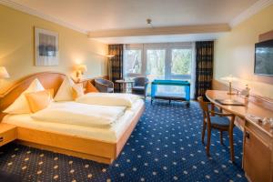 Postel nebo postele na pokoji v ubytování Hotel Asemann Planegg