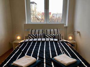 Una cama o camas en una habitación de Blu Apartment in Old Town