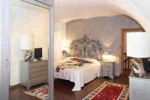 a bedroom with a bed and a mirror at Torino Chic in Turin