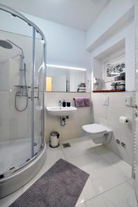 a bathroom with a shower and a toilet and a sink at M4You in Zagreb