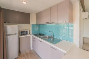 Kuchyň nebo kuchyňský kout v ubytování Camping Porto srl