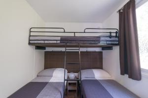 Postel nebo postele na pokoji v ubytování Camping Porto srl