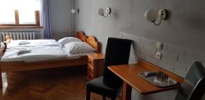 Łóżko lub łóżka w pokoju w obiekcie Hotel Azyl