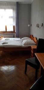Łóżko lub łóżka w pokoju w obiekcie Hotel Azyl