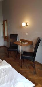 Łóżko lub łóżka w pokoju w obiekcie Hotel Azyl