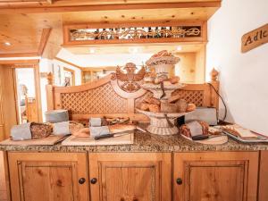a kitchen with a counter with bread on it at Haus Daheim in Oberstaufen +22 photos