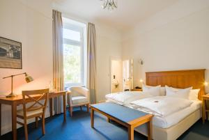 Postel nebo postele na pokoji v ubytování Hotel Brandies an der Messe