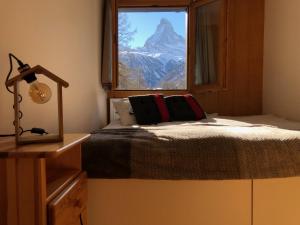 Postel nebo postele na pokoji v ubytování Apartment with beautiful views in Zermatt