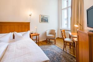 Postel nebo postele na pokoji v ubytování Hotel Brandies an der Messe