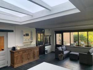 a large living room with a large skylight at B&B Dageraad in Bocholt