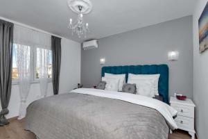 Postel nebo postele na pokoji v ubytování Luxurious Apartment Nino