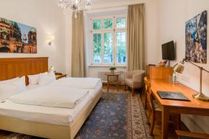 Postel nebo postele na pokoji v ubytování Hotel Brandies an der Messe