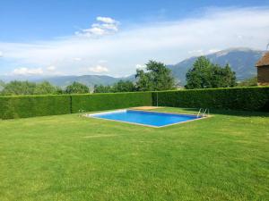 a swimming pool in the middle of a yard at OLOPTE I in Olopte
