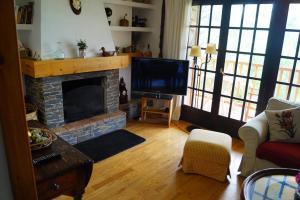 TV a/nebo společenská místnost v ubytování Apartamento 3 habitaciones en Llivia