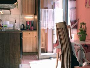 a kitchen with a table and a chair in it at Ferienhaus Trautner in Muggendorf