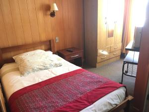 Säng eller sängar i ett rum på Hostal Buenaventura