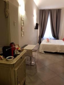 Postel nebo postele na pokoji v ubytování Il Sogno Torino Guesthouse