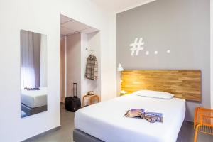 Ibis Styles Brindisi客房内的一张或多张床位