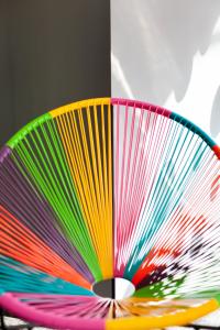 a colorful fan sitting on top of a table at Ibis Styles Brindisi in Brindisi