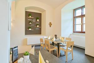 a dining room with a table and chairs at JUFA Hotel Stift Gurk in Gurk