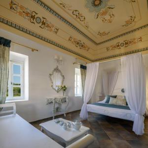 een kamer met een bed en een schuin plafond bij For All Seasons Mansion in Vóthon