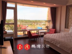 Cama o camas de una habitación en 玉灣鵬灣民宿Jade Bay B&B