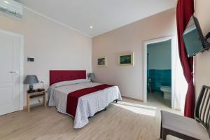 Postel nebo postele na pokoji v ubytování Hotel Balilla + 30 fotografií