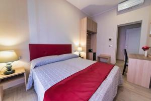 Postel nebo postele na pokoji v ubytování Hotel Balilla