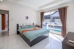 Postel nebo postele na pokoji v ubytování Villa la Barca + 37 fotografií