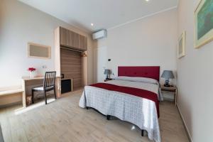 Postel nebo postele na pokoji v ubytování Hotel Balilla
