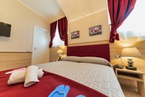 Postel nebo postele na pokoji v ubytování Hotel Balilla