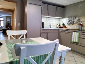 a kitchen with a table and chairs in a kitchen at Nonne8Appart in Görlitz