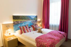 Postel nebo postele na pokoji v ubytování Hotel Edel Weiss