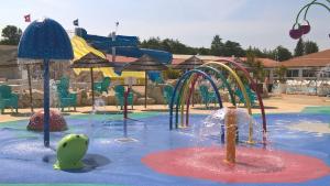 a water park with a water slide at Village Vacances 4 etoiles LES MATHES AUX CHARMETTES in Les Mathes