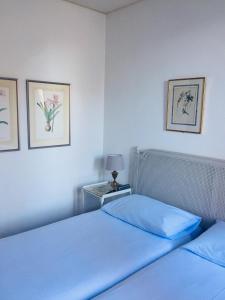 Un pat sau paturi într-o cameră la Piccolo Hotel