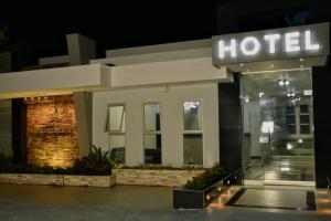 a hotel sign in front of a building at night at Hotel Prado Real in Barranquilla +34 photos